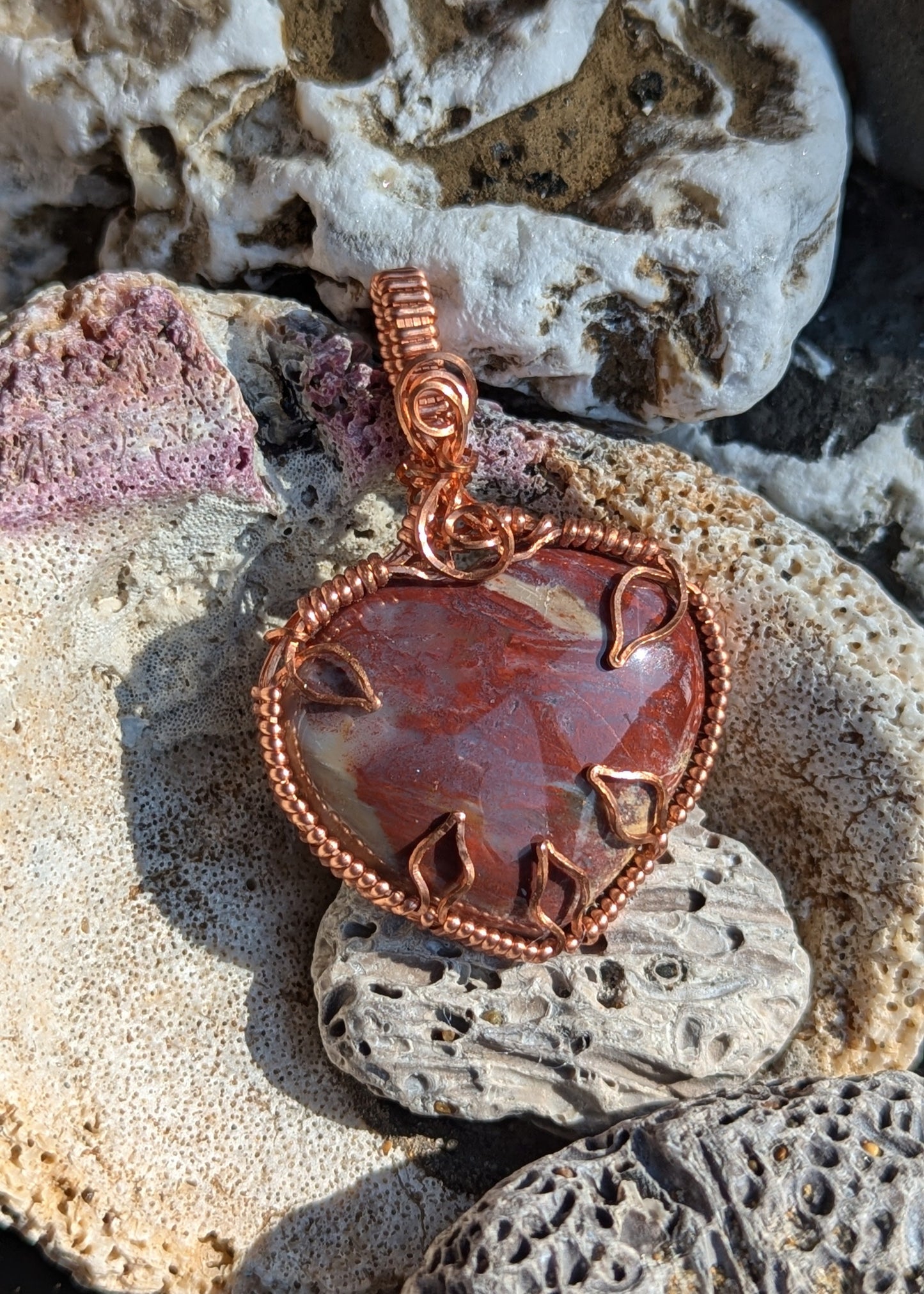 Petrified wood heart shaped pendant, copper