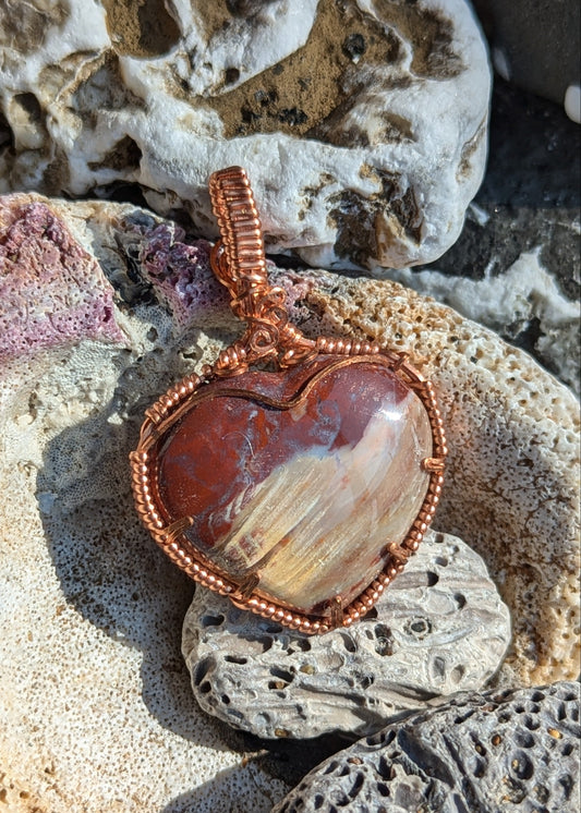 Petrified wood heart shaped pendant, copper